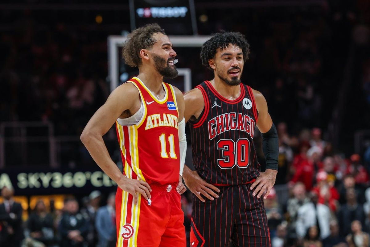 Dec 23, 2025; Atlanta, Georgia, USA; Atlanta Hawks guard Trae Young (11) talks to Chicago Bulls guard Tre Jones (30) during the fourth quarter at State Farm Arena. Mandatory Credit: Jordan Godfree-Imagn Images