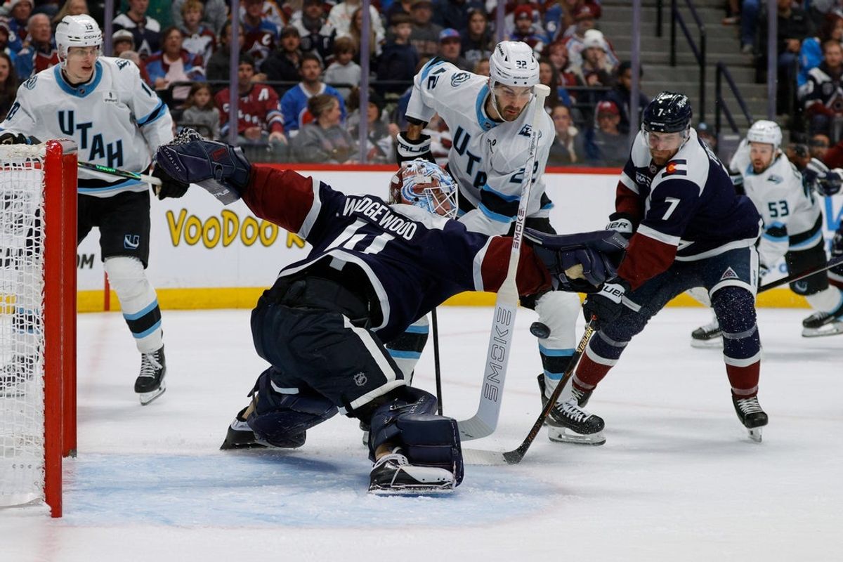 Dec 23, 2025; Denver, Colorado, USA; Colorado Avalanche goaltender Scott Wedgewood (41) loses his stick on a play as Utah Mammoth center Jack McBain (22) and defenseman Devon Toews (7) defend in the third period at Ball Arena. Mandatory Credit: Isaiah J. Downing-Imagn Images