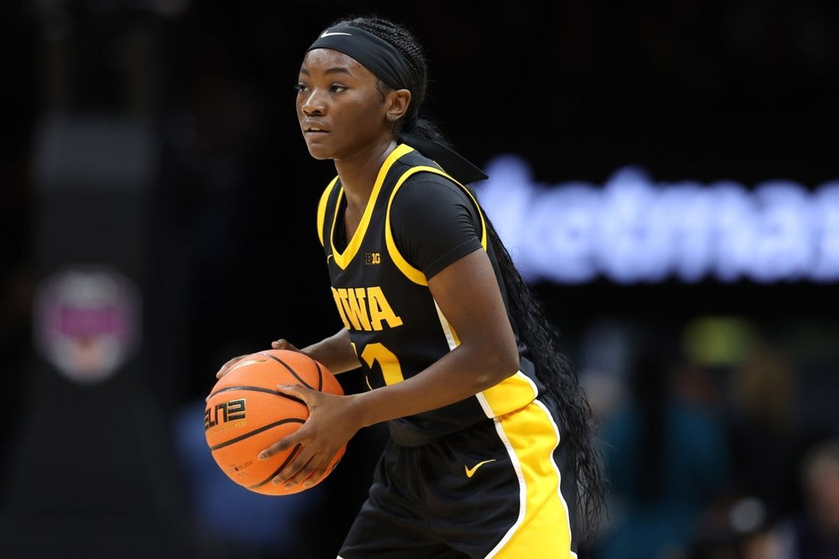 Dec 20, 2025; Brooklyn, New York, USA; Iowa Hawkeyes guard Chazadi Wright (11) looks to pass against the UConn Huskies during the first half at Barclays Center. Mandatory Credit: Pamela Smith-Imagn Images