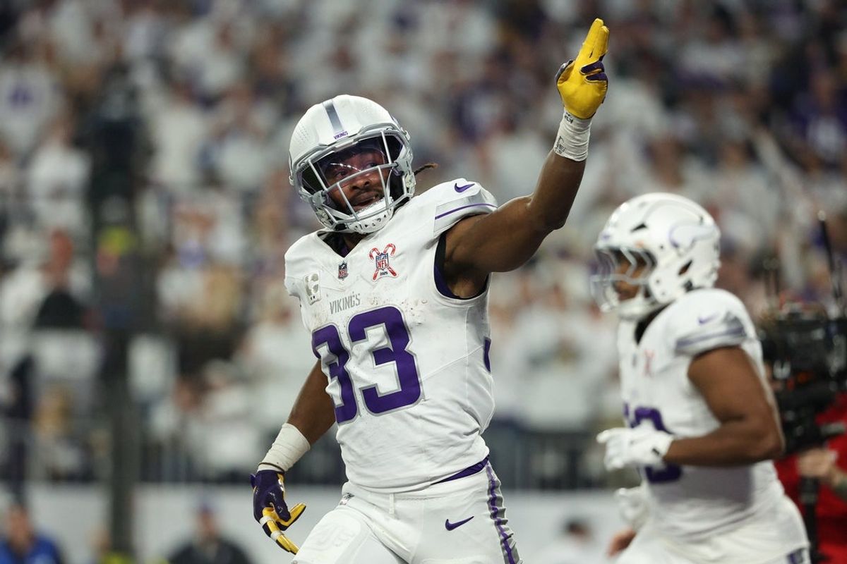 Dec 25, 2025; Minneapolis, Minnesota, USA; Minnesota Vikings running back Aaron Jones Sr. (33) celebrates after scoring a touchdown against the Detroit Lions in the first quarter at U.S. Bank Stadium. Mandatory Credit: Matt Krohn-Imagn Images