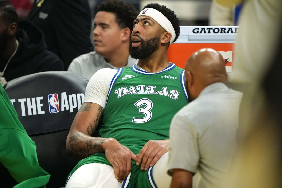 Dec 25, 2025; San Francisco, California, USA; Dallas Mavericks forward Anthony Davis (3) sits on the bench after suffering an injury during the second quarter against the Golden State Warriors at Chase Center. Mandatory Credit: Darren Yamashita-Imagn Images