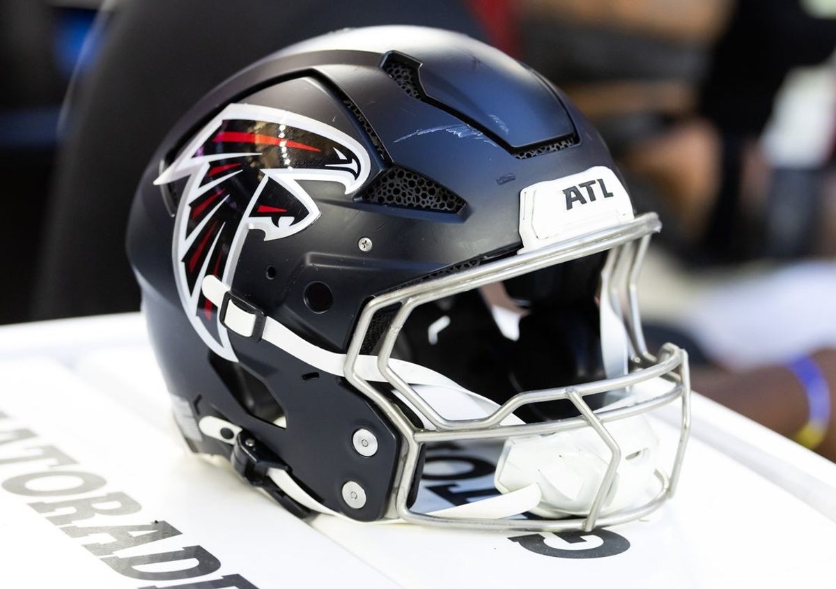Dec 21, 2025; Glendale, Arizona, USA; Detailed view of an Atlanta Falcons helmet at State Farm Stadium. Mandatory Credit: Mark J. Rebilas-Imagn Images