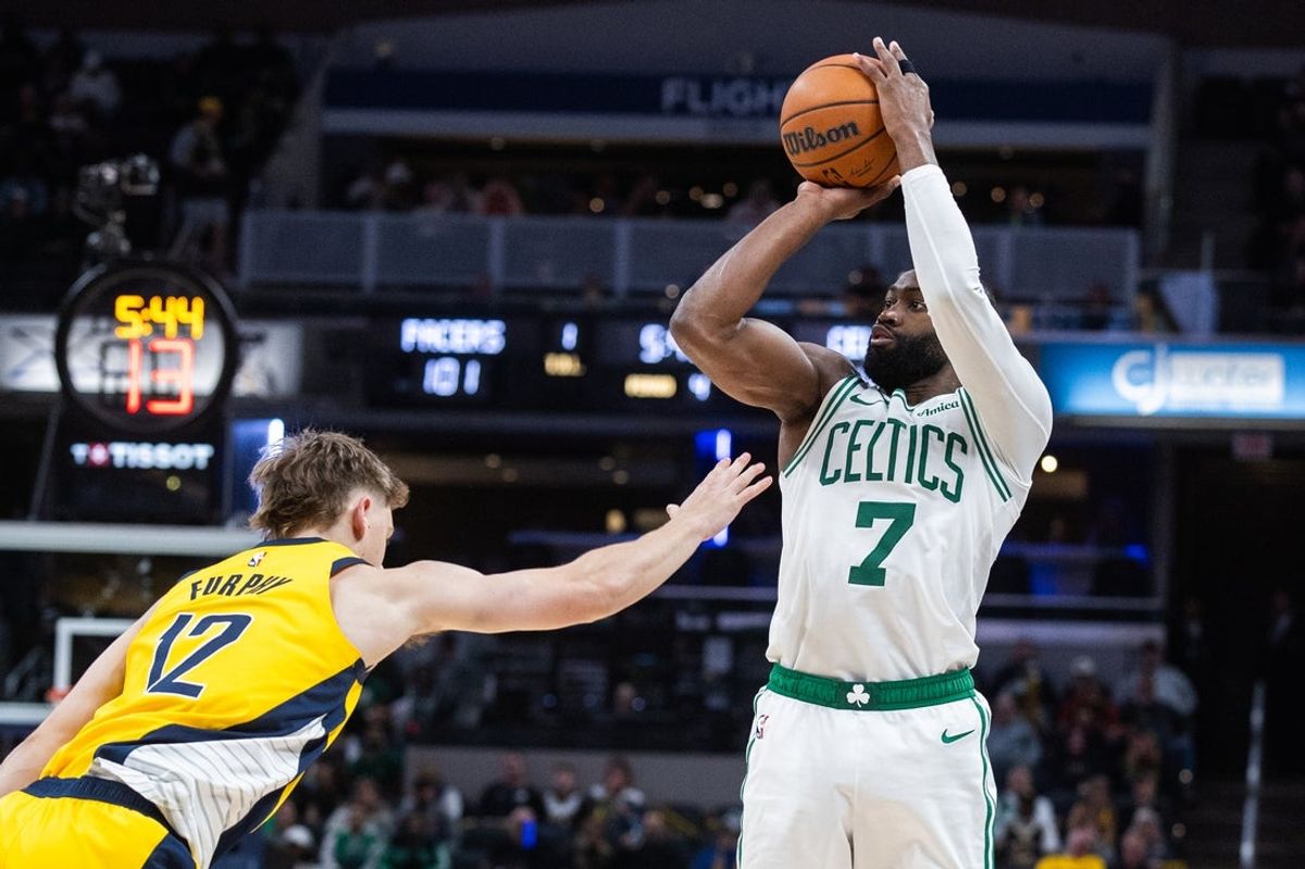 Dec 26, 2025; Indianapolis, Indiana, USA; Boston Celtics guard/forward Jaylen Brown (7) shoots the ball while Indiana Pacers guard Johnny Furphy (12) defends in the second half at Gainbridge Fieldhouse. Mandatory Credit: Trevor Ruszkowski-Imagn Images