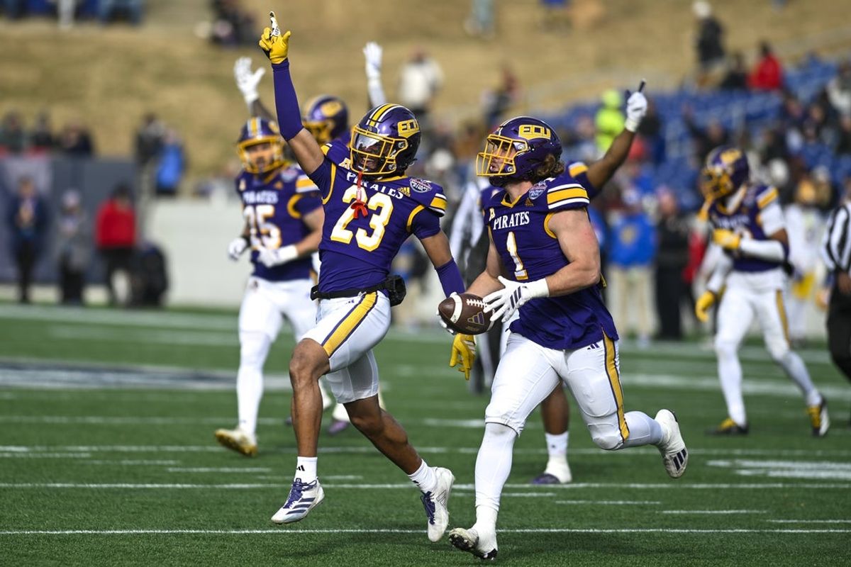Dec 27, 2025; Annapolis, MD, USA; East Carolina Pirates linebacker Jackson Barker (1) celebrates with defensive back Tavius Horne Jr. (23) after a fumble recovery  during the first half of the Military Bowl against the Pittsburgh Panthers at Navy-Marine Corps Stadium. Mandatory Credit: Tommy Gilligan-Imagn Images