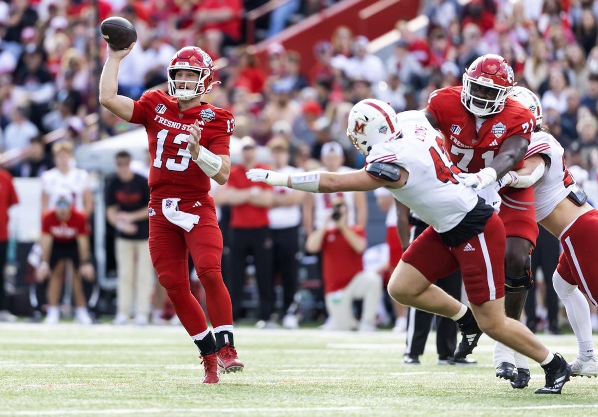 Dec 27, 2025; Tucson, AZ, USA; Fresno State Bulldogs quarterback E.J. Warner (13) against the Miami (OH) RedHawks during the Snoop Dogg Arizona Bowl at Casino Del Sol Stadium. Mandatory Credit: Mark J. Rebilas-Imagn Images