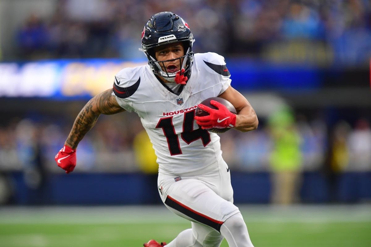 Dec 27, 2025; Inglewood, California, USA;  Houston Texans wide receiver Jaylin Noel (14) runs after the catch against the Los Angeles Chargers during the second half at SoFi Stadium. Mandatory Credit: Gary A. Vasquez-Imagn Images