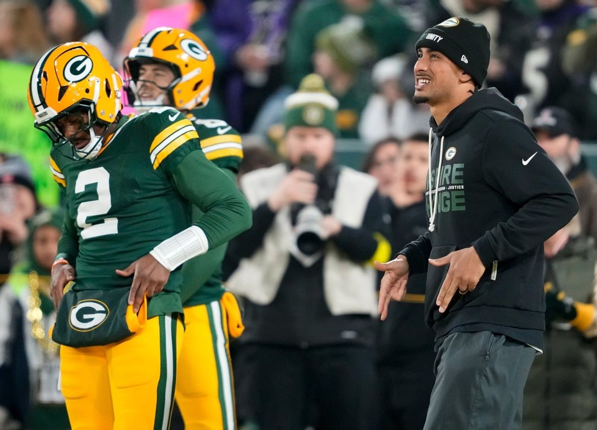 Dec 27, 2025; Green Bay, Wisconsin, USA; Green Bay Packers quarterback Malik Willis (2) and Green Bay Packers quarterback Jordan Love (10) do a handshake during warmups prior to the game against the Baltimore Ravens at Lambeau Field. Mandatory Credit: Kayla Wolf-Imagn Images
