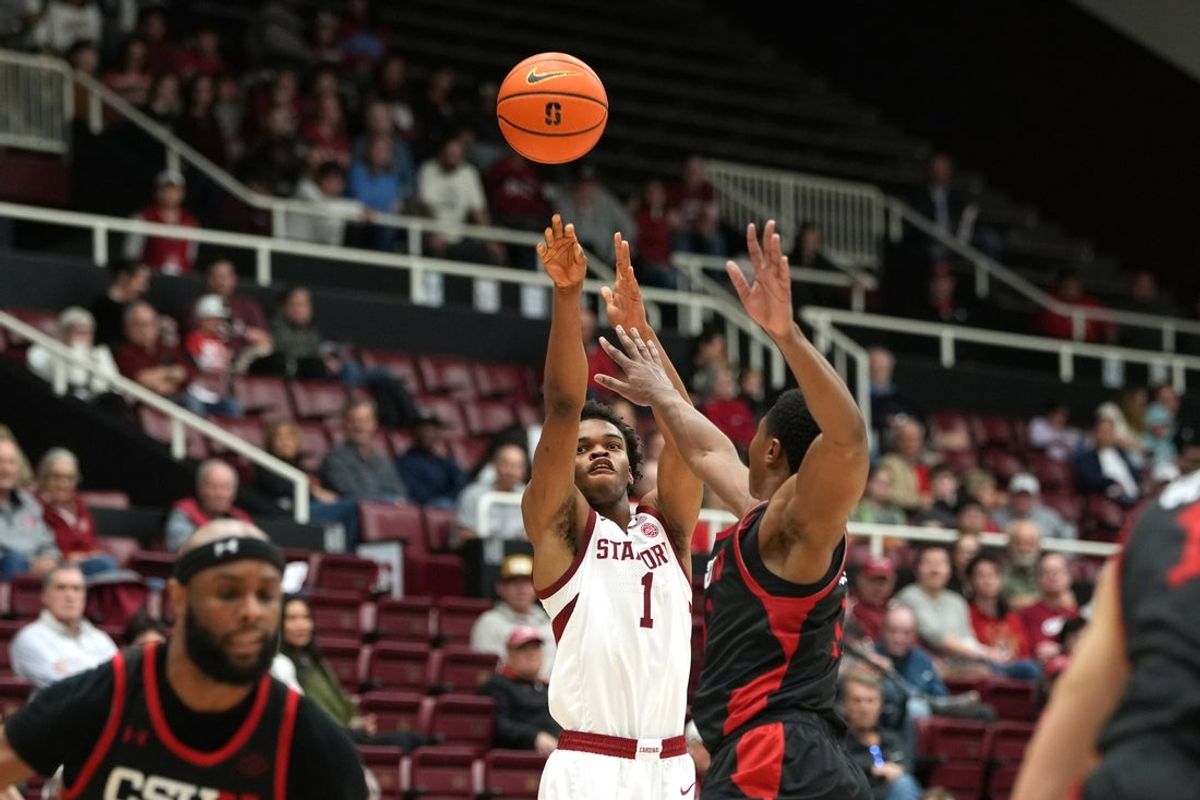 Dec 27, 2025; Stanford, California, USA; Stanford Cardinal guard Ebuka Okorie (1) shoots against CSUN Matadors forward Mahmoud Fofana (center right) during the first half at Maples Pavilion. Mandatory Credit: Darren Yamashita-Imagn Images