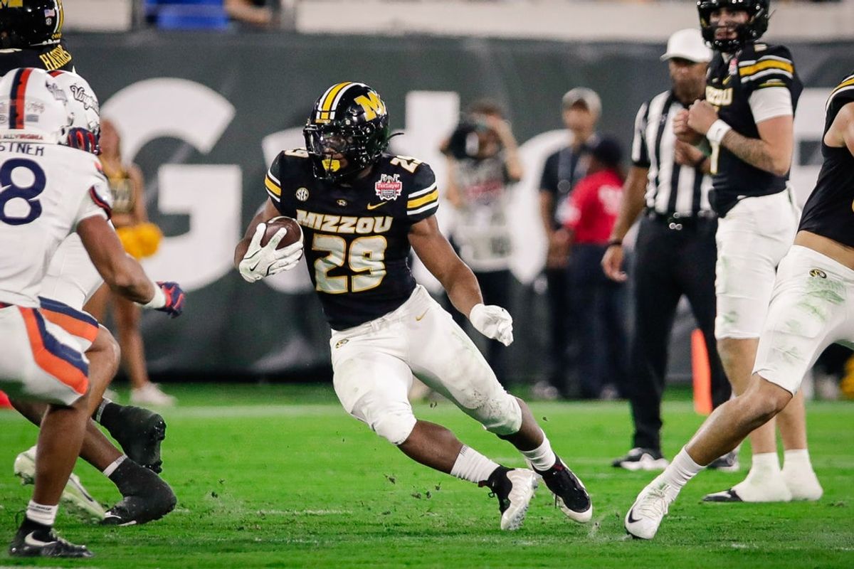 Dec 27, 2025; Jacksonville, FL, USA; Missouri Tigers running back Ahmad Hardy (29) runs the ball against the Virginia Cavaliers during the second quarter at EverBank Stadium. Mandatory Credit: Travis Register-Imagn Images