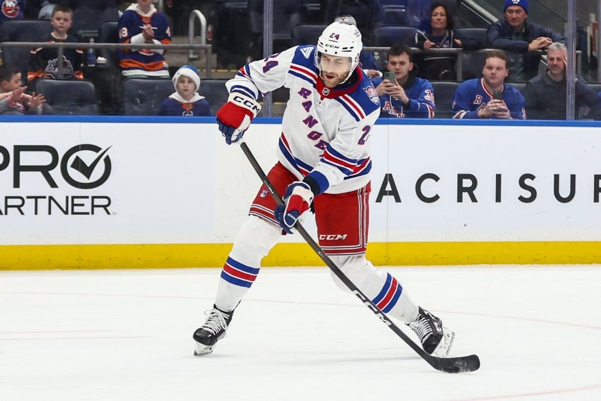 Dec 27, 2025; Elmont, New York, USA;  New York Rangers defenseman Carson Soucy (24) attempts a shot on goal during a penalty shot in the third period against the New York Islanders at UBS Arena. Mandatory Credit: Wendell Cruz-Imagn Images