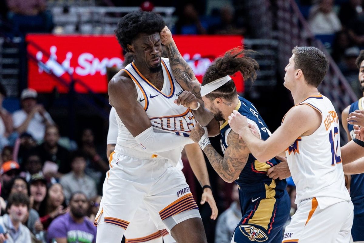 Dec 27, 2025; New Orleans, Louisiana, USA;  New Orleans Pelicans guard Jose Alvarado (15) gets into a scrum with Phoenix Suns center Mark Williams (15) over a play during the second half at Smoothie King Center. Mandatory Credit: Stephen Lew-Imagn Images