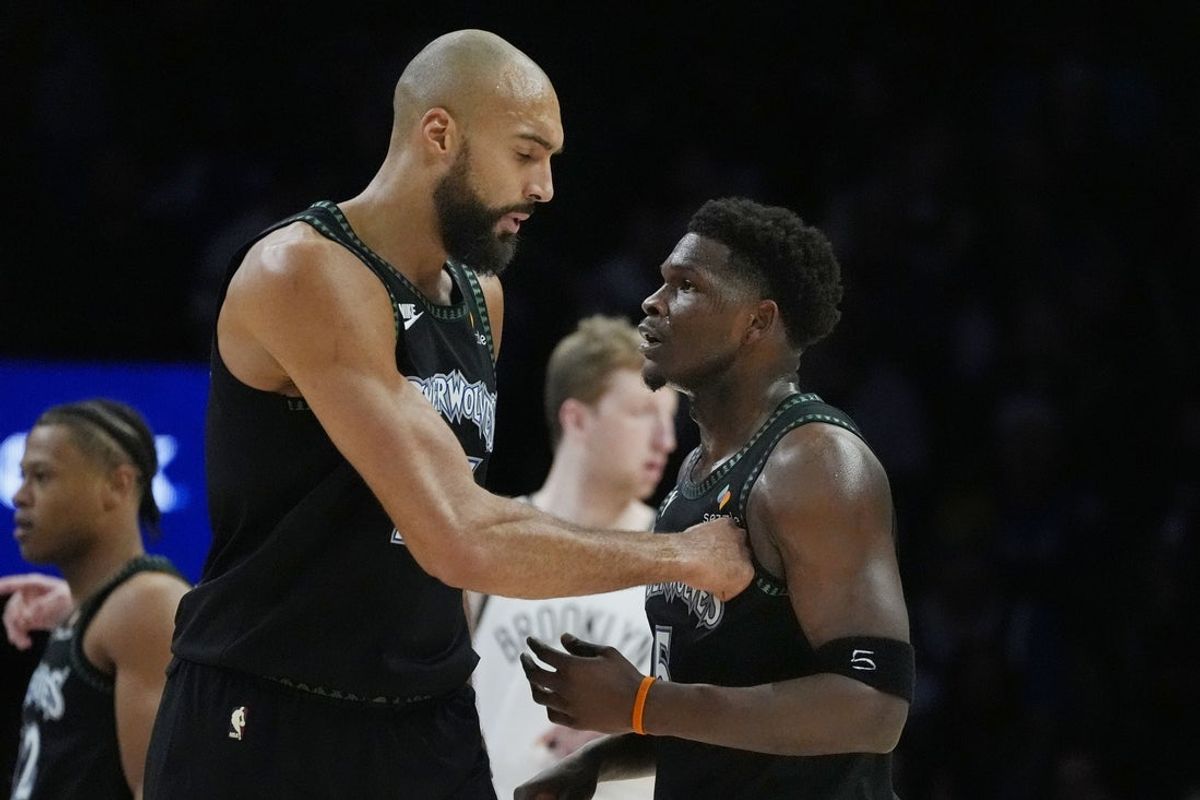 Dec 27, 2025; Minneapolis, Minnesota, USA; Minnesota Timberwolves center Rudy Gobert (27) congratulates guard Anthony Edwards (5) on his basket against the Brooklyn Nets in the first quarter at Target Center. Mandatory Credit: Bruce Kluckhohn-Imagn Images