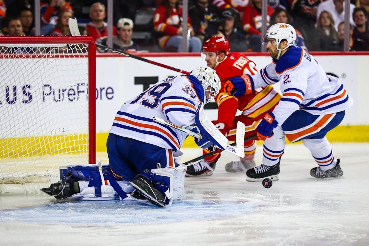 Dec 27, 2025; Calgary, Alberta, CAN; Edmonton Oilers goaltender Connor Ingram (39) makes a save against the Calgary Flames during the second period at Scotiabank Saddledome. Mandatory Credit: Sergei Belski-Imagn Images