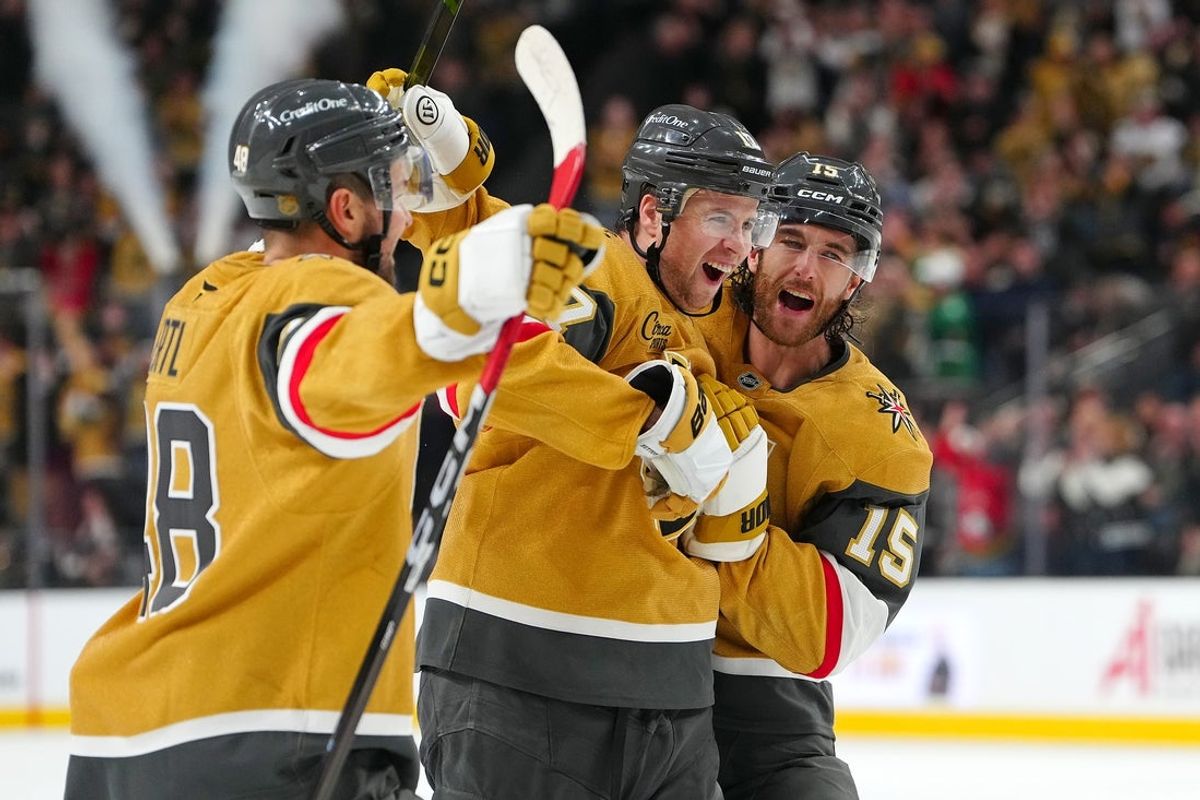 Dec 27, 2025; Las Vegas, Nevada, USA; Vegas Golden Knights defenseman Ben Hutton (17) celebrates with center Tomas Hertl (48), and defenseman Noah Hanifin (15) after scoring a goal against the Colorado Avalanche during the second period at T-Mobile Arena. Mandatory Credit: Stephen R. Sylvanie-Imagn Images