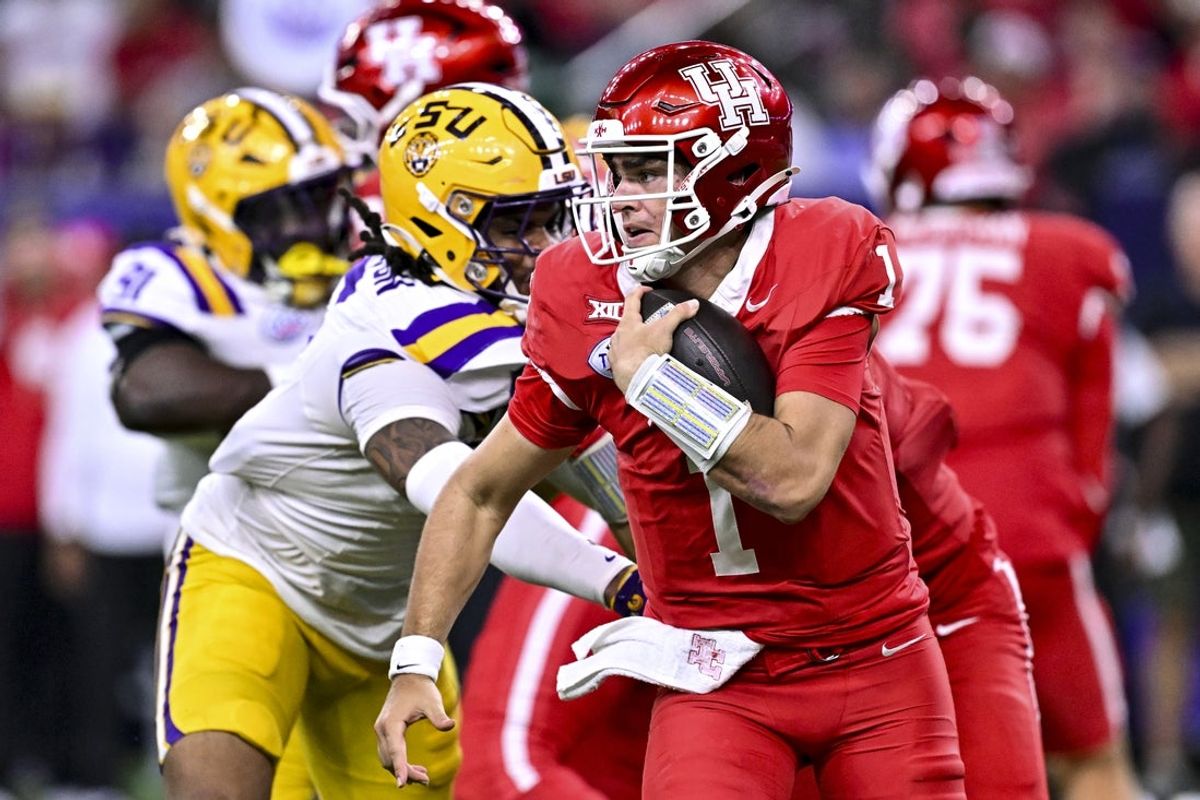 Dec 27, 2025; Houston, TX, USA; Houston Cougars quarterback Conner Weigman (1) runs the ball during the second half against the Louisiana State Tigers at NRG Stadium. Mandatory Credit: Maria Lysaker-Imagn Images
