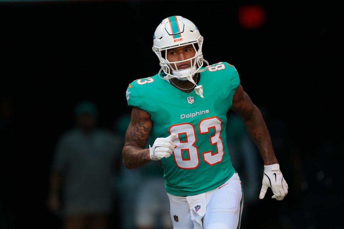 Dec 28, 2025; Miami Gardens, Florida, USA; Miami Dolphins tight end Darren Waller (83) runs out for player introductions prior to a game against the Tampa Bay Buccaneers at Hard Rock Stadium. Mandatory Credit: Sam Navarro-Imagn Images