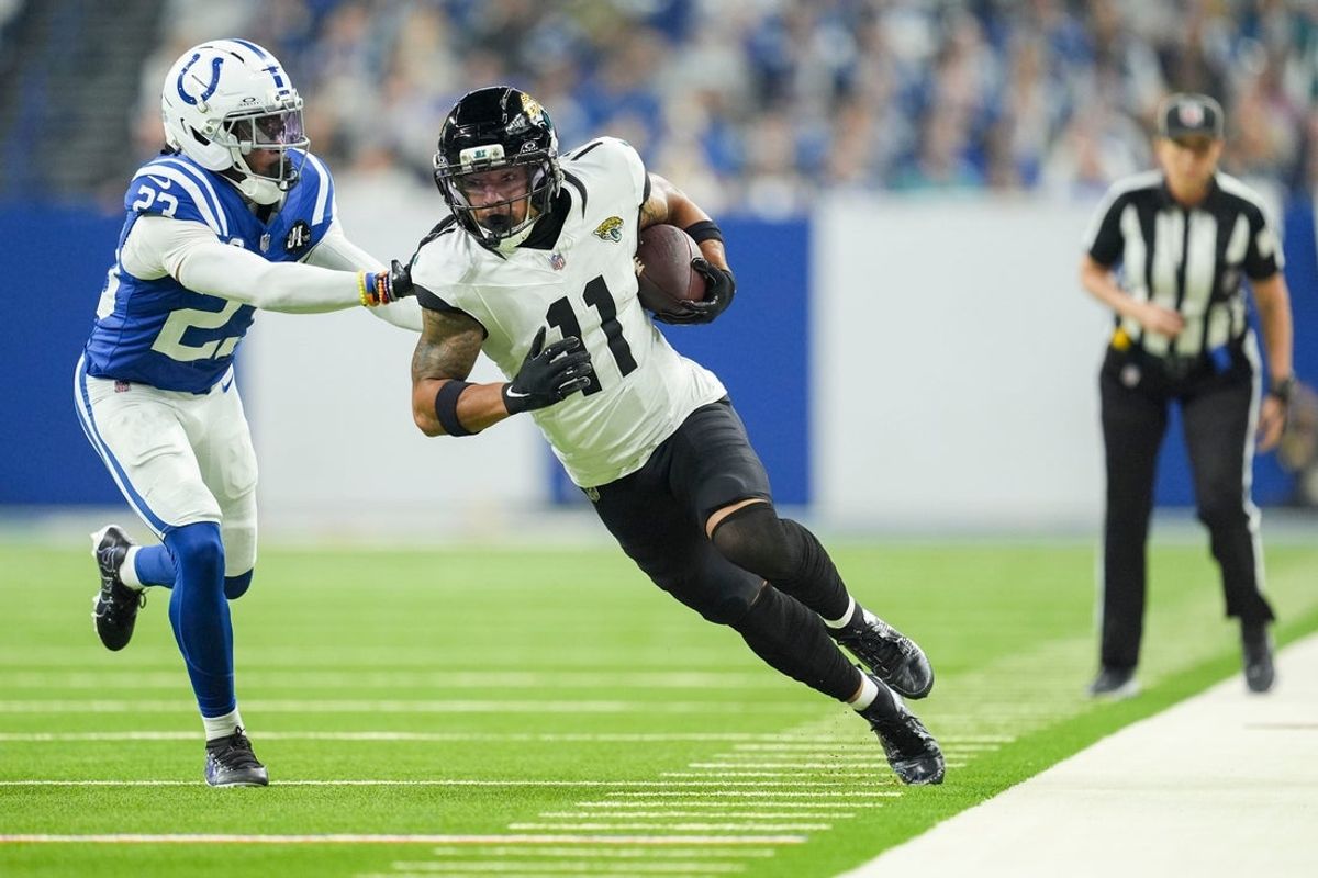 Indianapolis Colts cornerback Kenny Moore II (23) shoves Jacksonville Jaguars wide receiver Parker Washington (11) out of bounds Sunday, Dec. 28, 2025, during a game against the Jacksonville Jaguars at Lucas Oil Stadium in Indianapolis.