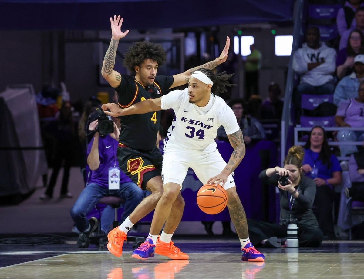 Dec 28, 2025; Manhattan, Kansas, USA; Kansas State Wildcats guard Nate Johnson (34) is guarded by Louisiana-Monroe Warhawks forward Lavell Brondex (4) during the first half at Bramlage Coliseum. Mandatory Credit: Scott Sewell-Imagn Images