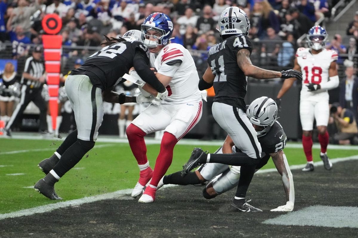 Dec 28, 2025; Paradise, Nevada, USA; New York Giants quarterback Jaxson Dart (6) dives for a touchdown in the second quarter against the Las Vegas Raiders at Allegiant Stadium. Mandatory Credit: Kirby Lee-Imagn Images