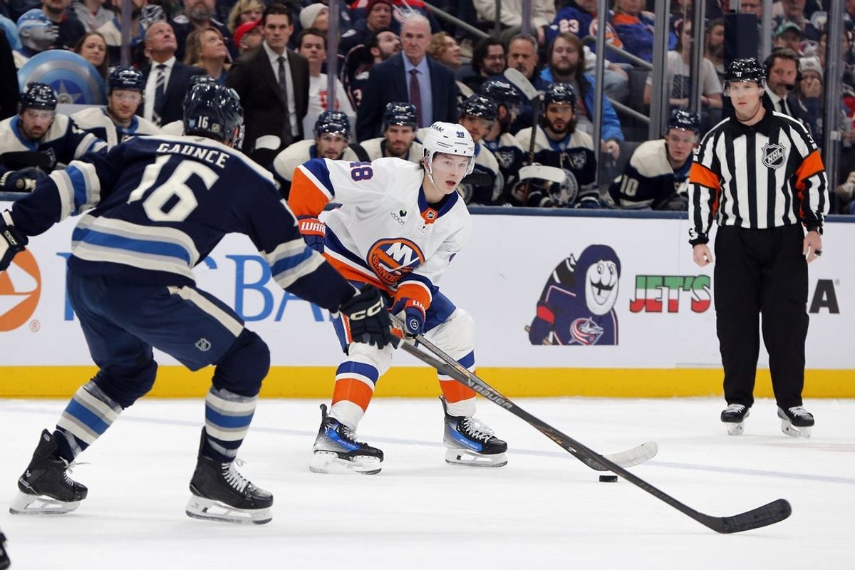 Dec 28, 2025; Columbus, Ohio, USA; New York Islanders defenseman Matthew Schaefer (48) looks to pass as Columbus Blue Jackets center Brendan Gaunce (16) defends during the first period at Nationwide Arena. Mandatory Credit: Russell LaBounty-Imagn Images