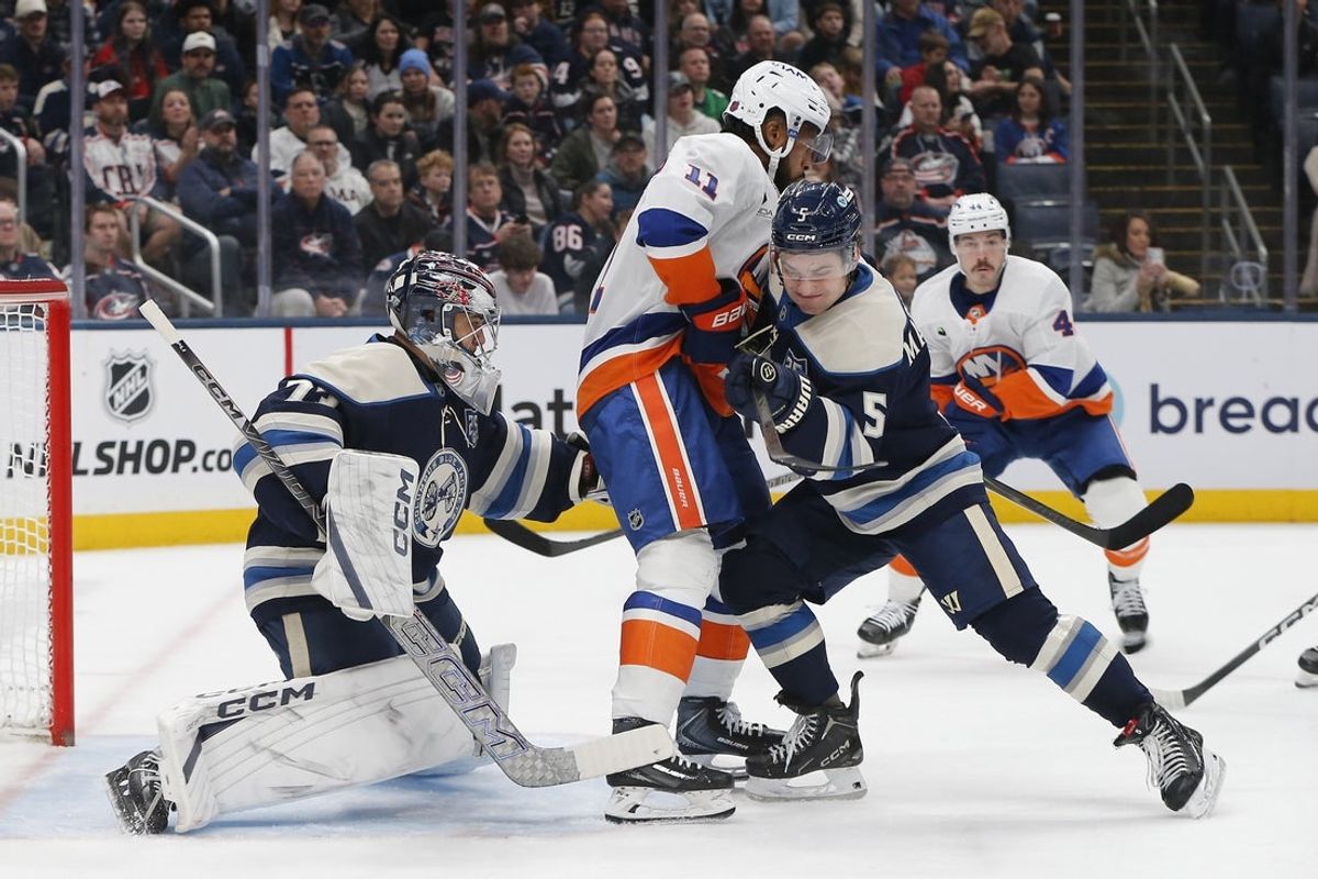 Dec 28, 2025; Columbus, Ohio, USA; Columbus Blue Jackets goalie Jet Greaves (73) makes a glove save as New York Islanders left wing Anthony Duclair (11) looks for a rebound during the first period at Nationwide Arena. Mandatory Credit: Russell LaBounty-Imagn Images