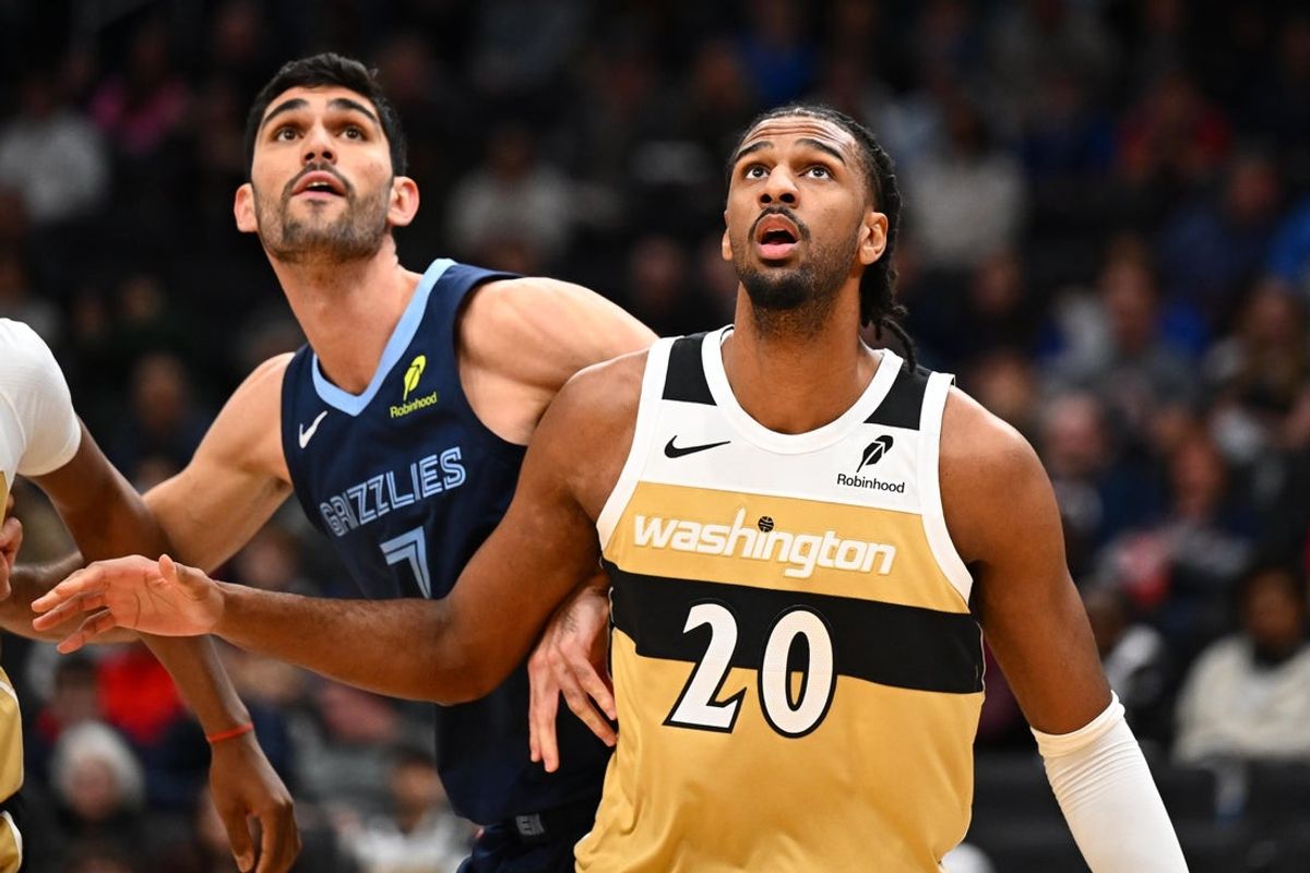 Dec 28, 2025; Washington, District of Columbia, USA; Washington Wizards center Alex Sarr (20) boxes out Memphis Grizzlies forward Santi Aldama (7) during the first half at Capital One Arena. Mandatory Credit: Brad Mills-Imagn Images