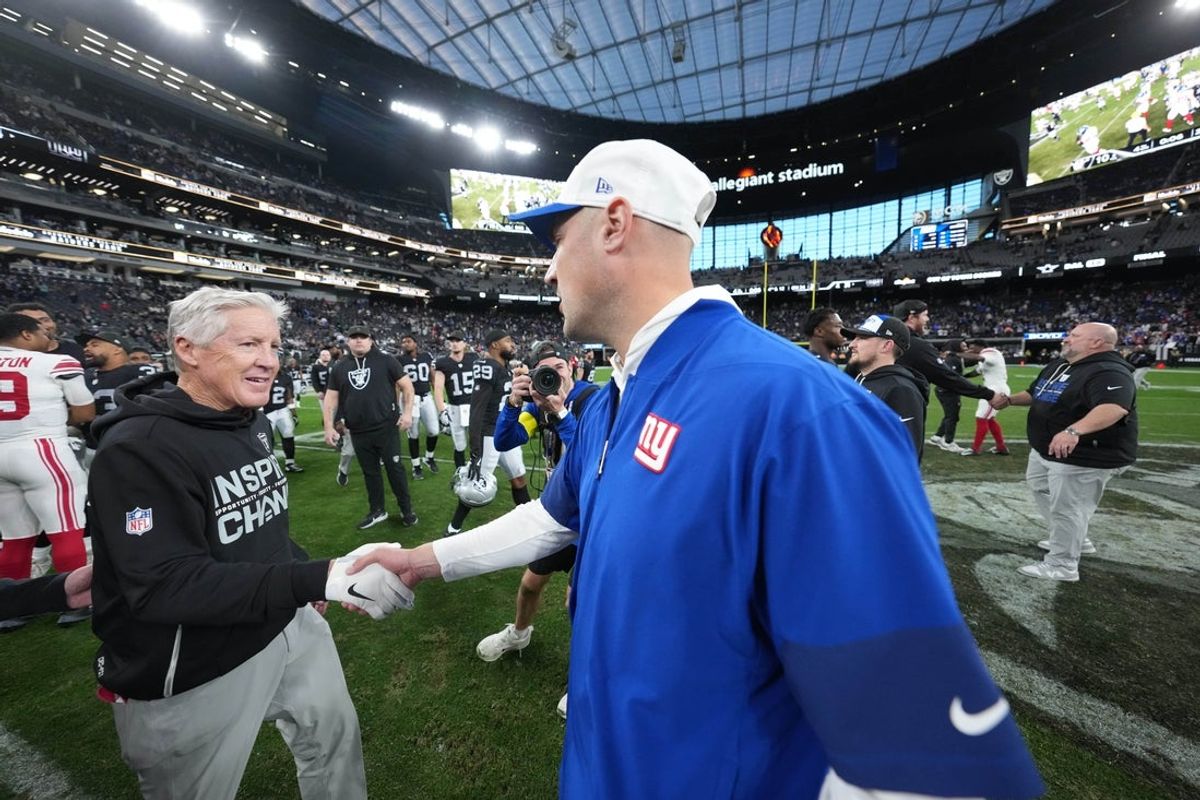 Dec 28, 2025; Paradise, Nevada, USA; New York Giants head coach Mike Kafka shakes hands with Las Vegas Raiders head coach Pete Carroll after the game at Allegiant Stadium. Mandatory Credit: Kirby Lee-Imagn Images