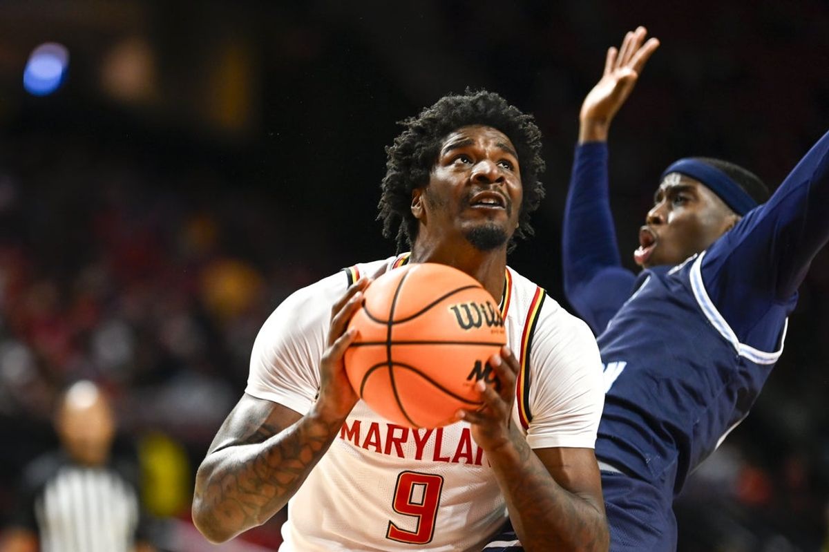 Dec 28, 2025; College Park, Maryland, USA; Maryland Terrapins forward Solomon Washington (9) makes a move to there basket on Old Dominion Monarchs guard Robert Davis Jr. (4) during the second half  at Xfinity Center. Mandatory Credit: Tommy Gilligan-Imagn Images