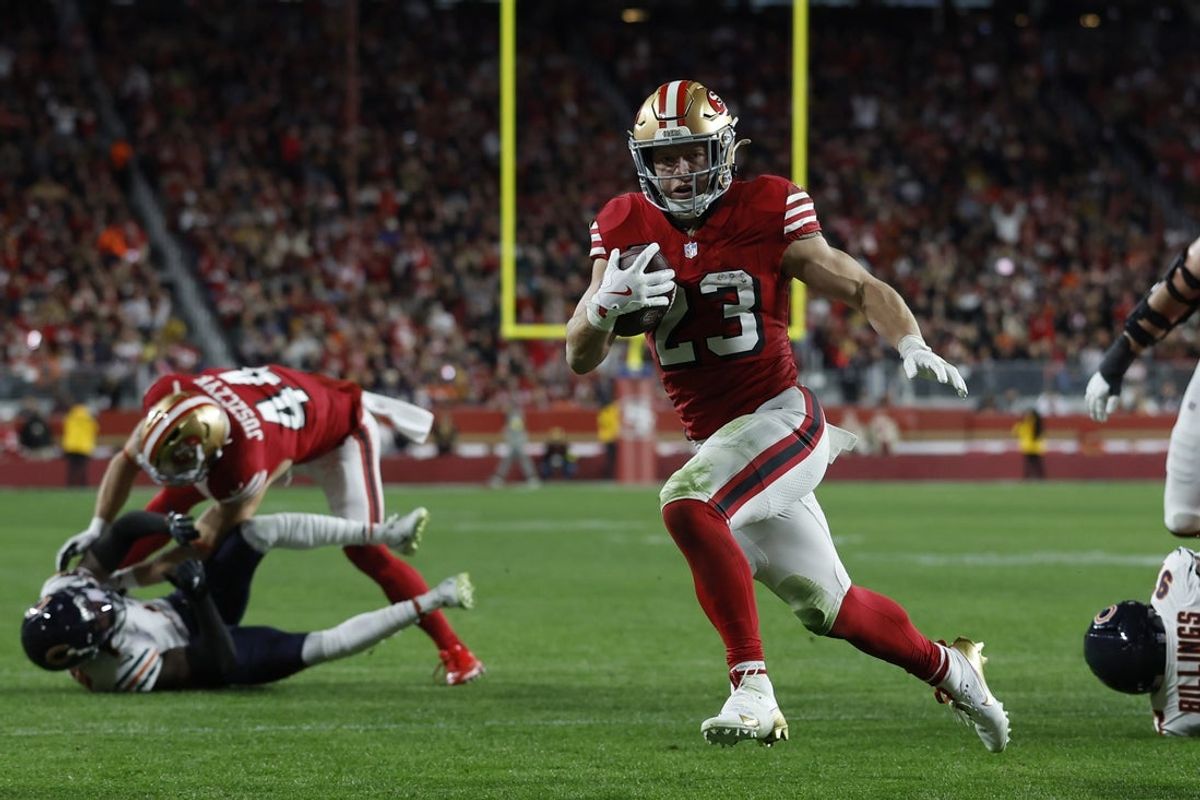 Dec 28, 2025; Santa Clara, California, USA; San Francisco 49ers running back Christian McCaffrey (23) runs for a touchdown against the Chicago Bears in the first half at Levi's Stadium. Mandatory Credit: Sergio Estrada-Imagn Images