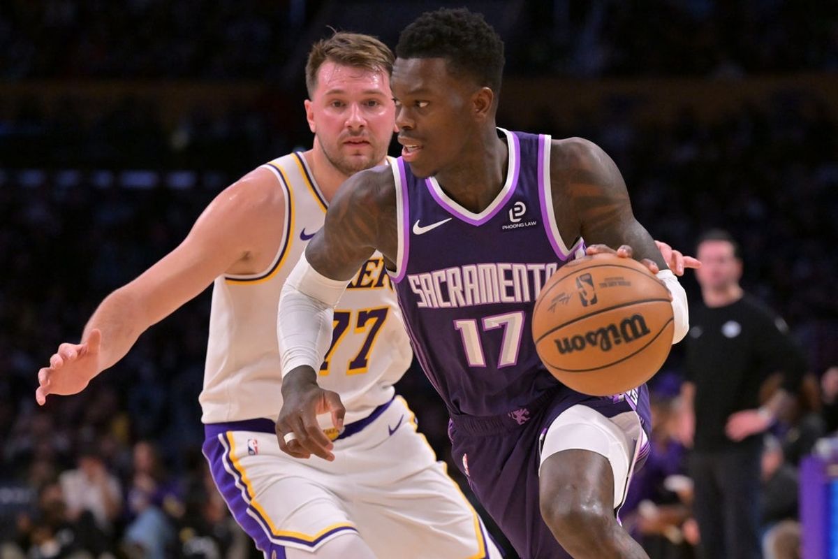 Dec 28, 2025; Los Angeles, California, USA;  Sacramento Kings guard Dennis Schroder (17) drives past Los Angeles Lakers guard Luka Doncic (77) in the first half at Crypto.com Arena. Mandatory Credit: Jayne Kamin-Oncea-Imagn Images