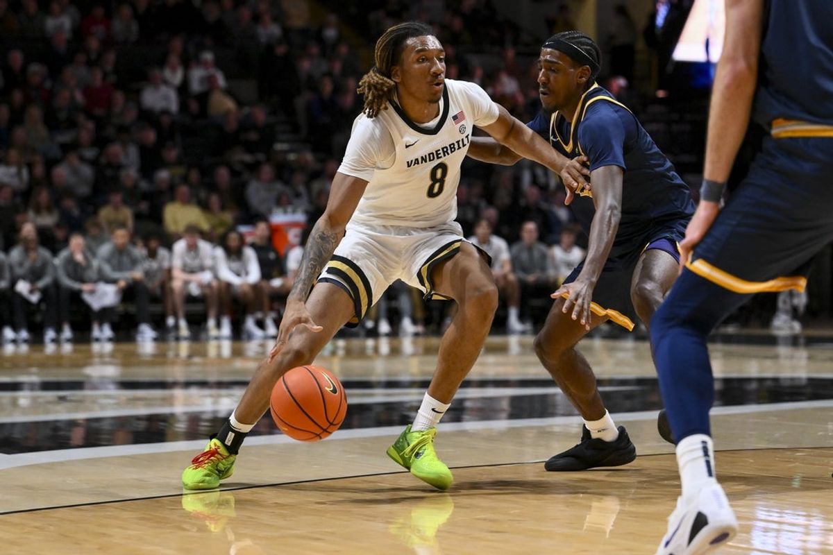 Dec 29, 2025; Nashville, Tennessee, USA;  Vanderbilt Commodores guard Tyler Harris (8) drives to the basket against the New Haven Chargers during the first half at Memorial Gymnasium. Mandatory Credit: Steve Roberts-Imagn Images