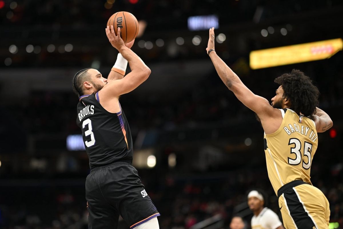 Dec 29, 2025; Washington, District of Columbia, USA;  Phoenix Suns forward Dillon Brooks (3) attempts a jump shot in front of Washington Wizards forward Marvin Bagley III (35) during the first quarter at Capital One Arena. Mandatory Credit: Rafael Suanes-Imagn Images