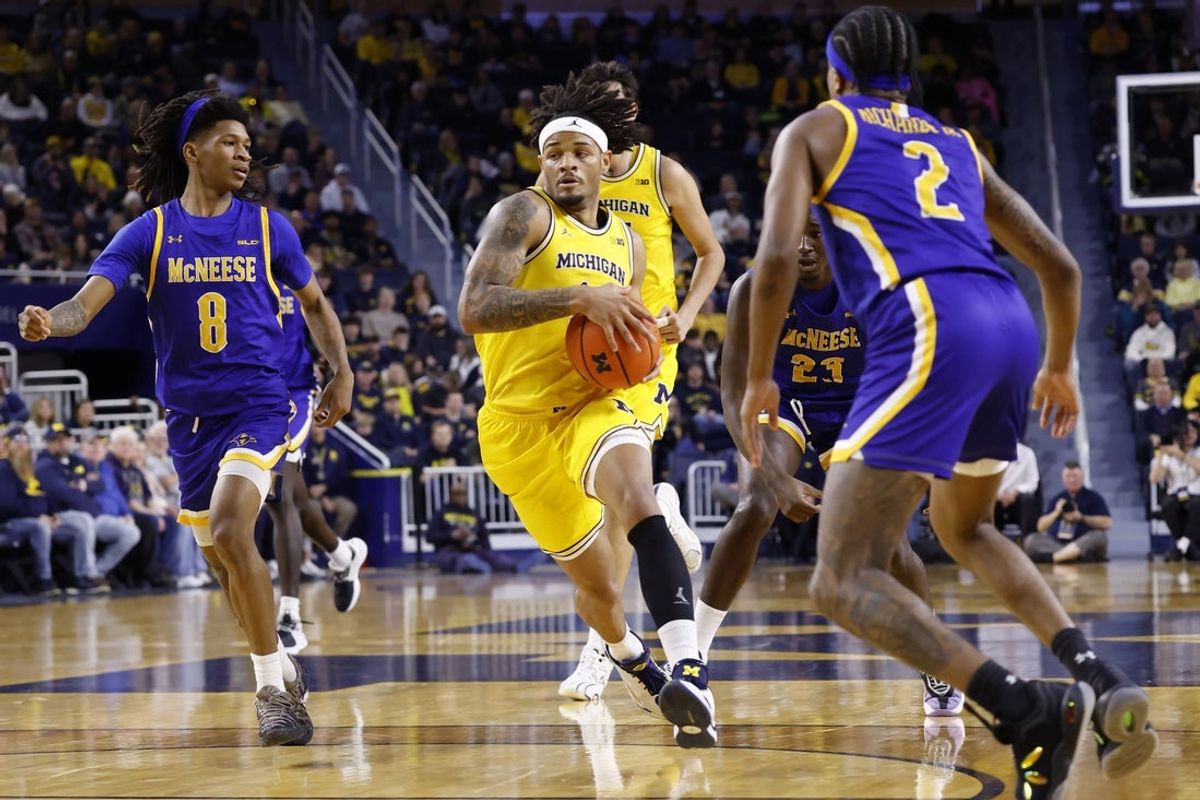 Dec 29, 2025; Ann Arbor, Michigan, USA;  Michigan Wolverines guard Roddy Gayle Jr. (11) dribbles in the first half against the McNeese Cowboys at Crisler Center. Mandatory Credit: Rick Osentoski-Imagn Images