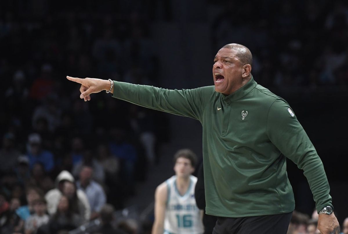 Dec 29, 2025; Charlotte, North Carolina, USA;  Milwaukee Bucks head coach Doc Rivers reacts during the first half against the Charlotte Hornets at the Spectrum Center. Mandatory Credit: Sam Sharpe-Imagn Images