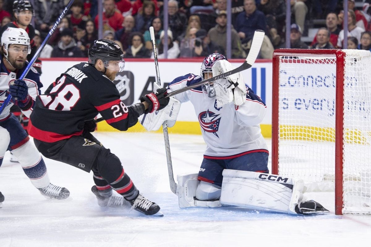 Dec 29, 2025; Ottawa, Ontario, CAN; Columbus Blue Jackets goalie Jet Greaves (73) makes a save in front of Ottawa Senators right wing Claude Giroux (28) in the first period at the Canadian Tire Centre. Mandatory Credit: Marc DesRosiers-IMAGN Images