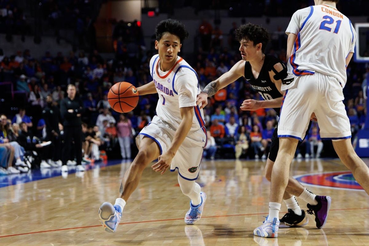 Dec 29, 2025; Gainesville, Florida, USA; Florida Gators guard Xaivian Lee (1) dribbles the ball while Dartmouth Big Green guard Connor Amundsen (30) defends during the second half at Exactech Arena at the Stephen C. O'Connell Center. Mandatory Credit: Matt Pendleton-Imagn Images