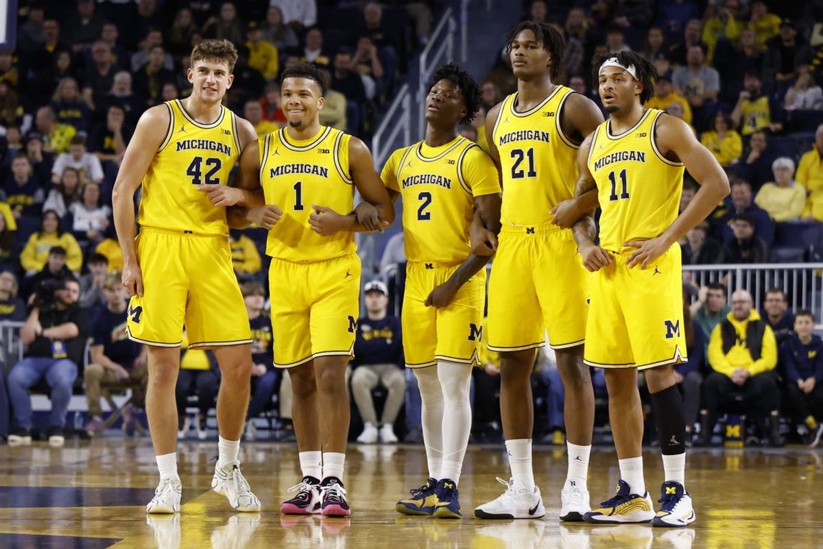 Dec 29, 2025; Ann Arbor, Michigan, USA;  Michigan Wolverines forward Will Tschetter (42) guard Trey McKenney (1) guard L.J. Cason (2) forward Morez Johnson Jr. (21) and guard Roddy Gayle Jr. (11) look on in the second half against the McNeese Cowboys at Crisler Center. Mandatory Credit: Rick Osentoski-Imagn Images