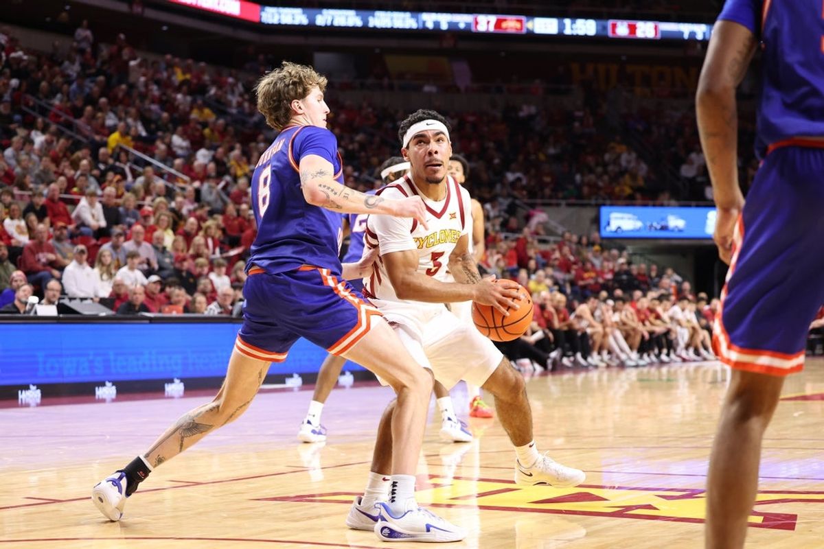 Dec 29, 2025; Ames, Iowa, USA; Houston Christian Huskies forward Trent Johnson (8) defends Iowa State Cyclones guard Tamin Lipsey (3) at James H. Hilton Coliseum. Mandatory Credit: Reese Strickland-Imagn Images