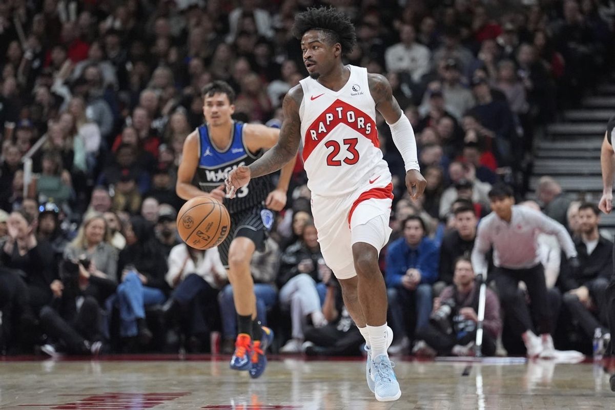 Dec 29, 2025; Toronto, Ontario, CAN; Toronto Raptors guard Jamal Shead (23) dribbles the ball up court against the Orlando Magic during the first half at Scotiabank Arena. Mandatory Credit: John E. Sokolowski-Imagn Images