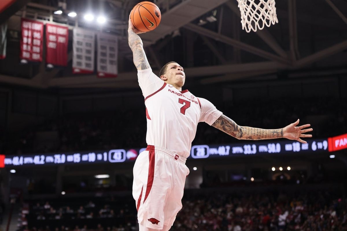 Dec 29, 2025; Fayetteville, Arkansas, USA; Arkansas Razorbacks forward Trevon Brazile (7) goes up for a dunk during the first half against the James Madison Dukes at Bud Walton Arena. Mandatory Credit: Nelson Chenault-Imagn Images