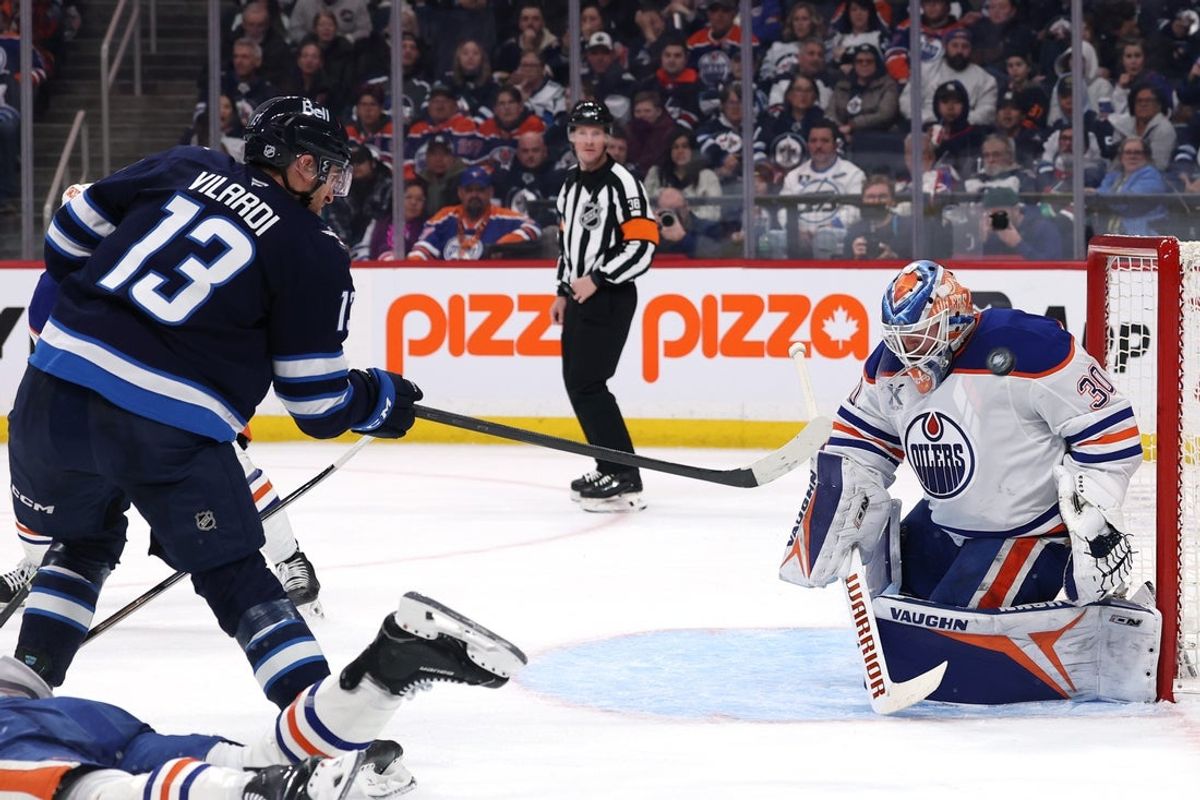 Dec 29, 2025; Winnipeg, Manitoba, CAN; Edmonton Oilers goaltender Calvin Pickard (30) makes a shoulder pad save on a shot by Winnipeg Jets center Gabriel Vilardi (13) in the second period at Canada Life Centre. Mandatory Credit: James Carey Lauder-Imagn Images