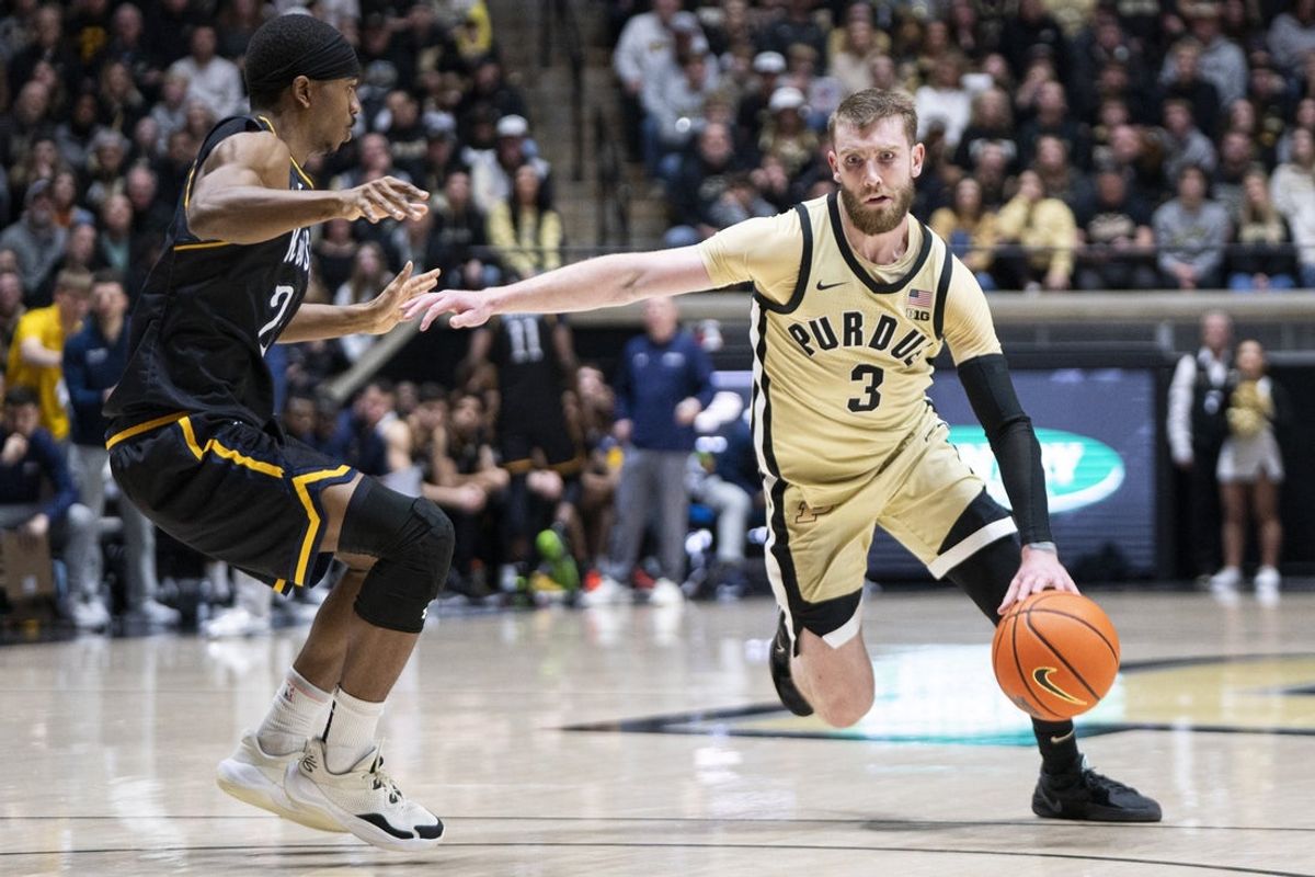 Dec 29, 2025; West Lafayette, Indiana, USA; Purdue Boilermakers guard Braden Smith (3) looks to dribbled around Kent State Golden Flashes guard Jahari Williamson (25) during the second half at Mackey Arena. Mandatory Credit: Jacob Musselman-Imagn Images