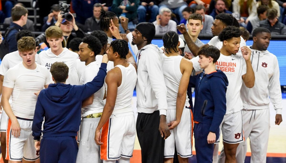 Auburn Tigers huddle during early warm ups befpore the Queens University of Charlotte game at Neville Arena on the Auburn University campus in Auburn, Ala., on Monday evening December 29, 2025.