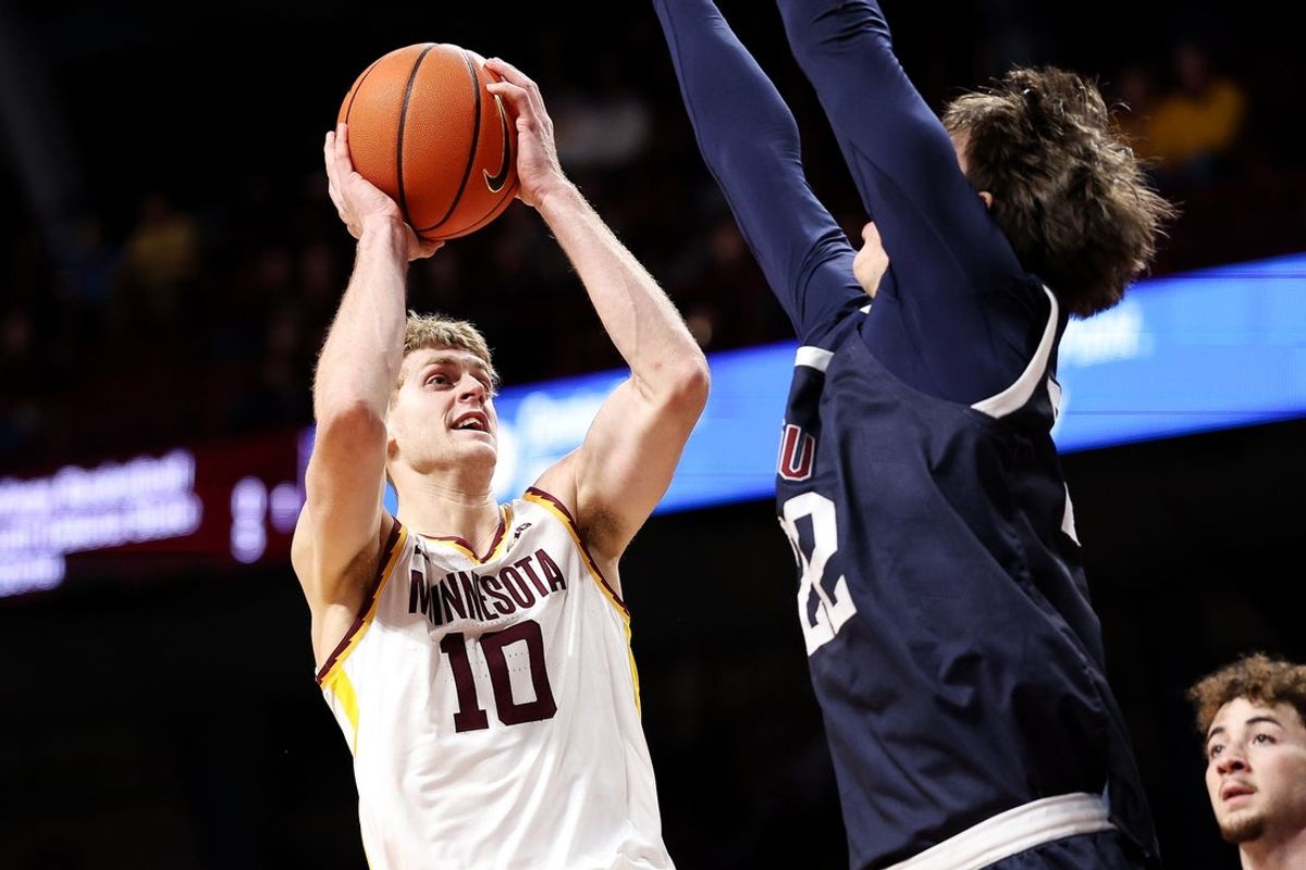 Dec 29, 2025; Minneapolis, Minnesota, USA; Minnesota Golden Gophers forward Cade Tyson (10) shoots as Fairleigh Dickinson Knights center Cyril Martynov (22) defends during the first half at Williams Arena. Mandatory Credit: Matt Krohn-Imagn Images