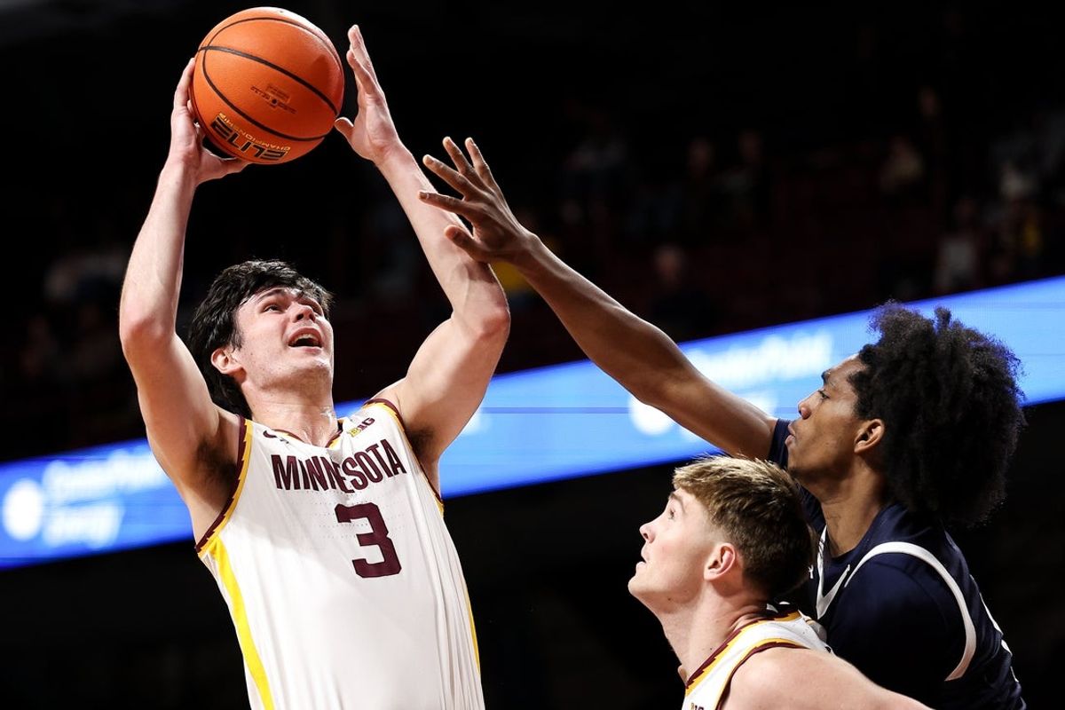 Dec 29, 2025; Minneapolis, Minnesota, USA;Minnesota Golden Gophers forward Bobby Durkin (3) shoots the ball as Fairleigh Dickinson Knights guard Josiah Francis (15) defends during the first half at Williams Arena. Mandatory Credit: Matt Krohn-Imagn Images
