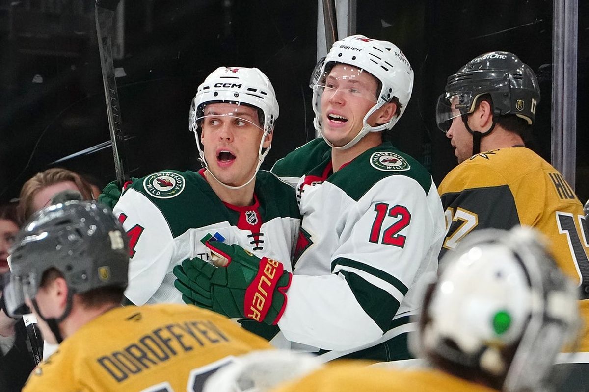 Dec 29, 2025; Las Vegas, Nevada, USA; Minnesota Wild left wing Matt Boldy (12) celebrates with Minnesota Wild center Joel Eriksson Ek (14) after scoring a goal against the Vegas Golden Knights during the first period at T-Mobile Arena. Mandatory Credit: Stephen R. Sylvanie-Imagn Images