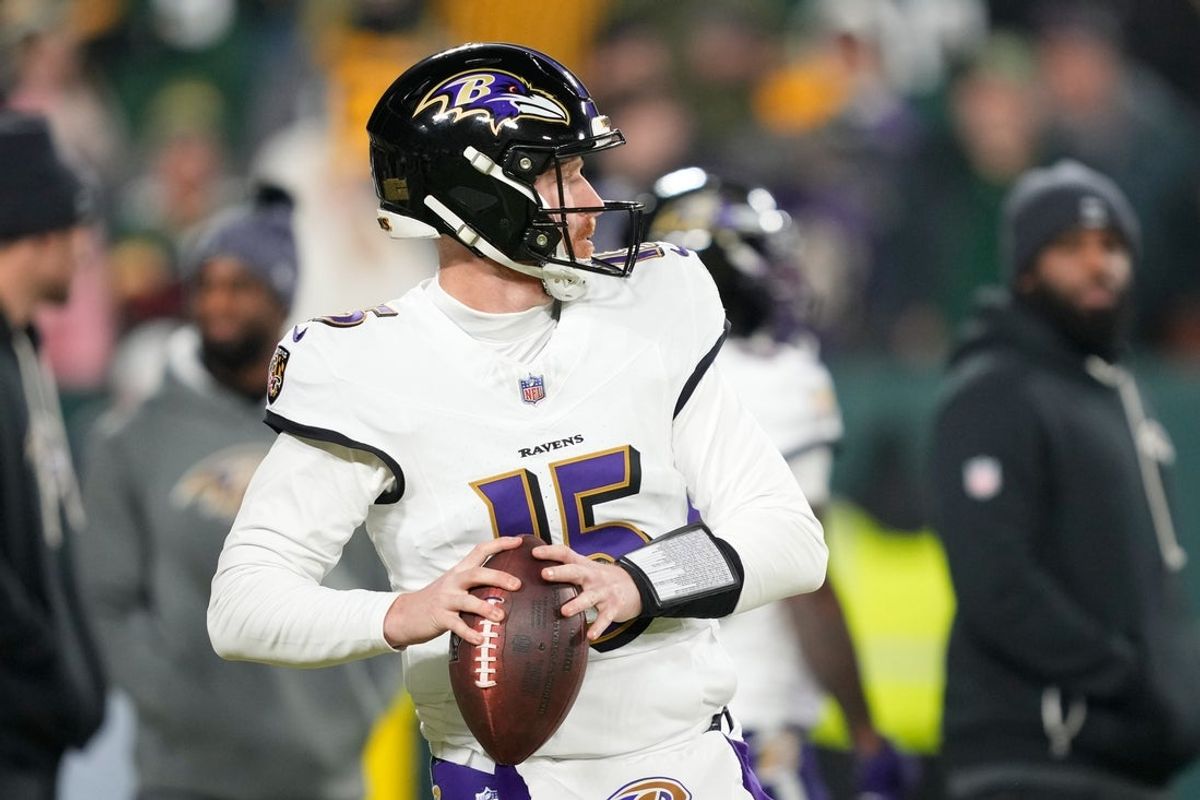 Dec 27, 2025; Green Bay, Wisconsin, USA; Baltimore Ravens quarterback Cooper Rush (15) throws during warmups before a game against the Green Bay Packers at Lambeau Field. Mandatory Credit: Kayla Wolf-Imagn Images