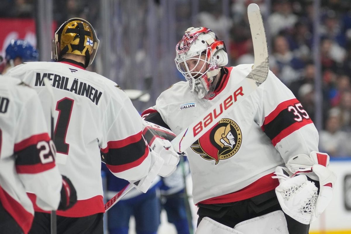 Dec 27, 2025; Toronto, Ontario, CAN; Ottawa Senators goaltender Linus Ullmark (35) taps goaltender Leevi Merilainen (1) after getting pulled from the game during the second period  at Scotiabank Arena. Mandatory Credit: John E. Sokolowski-Imagn Images