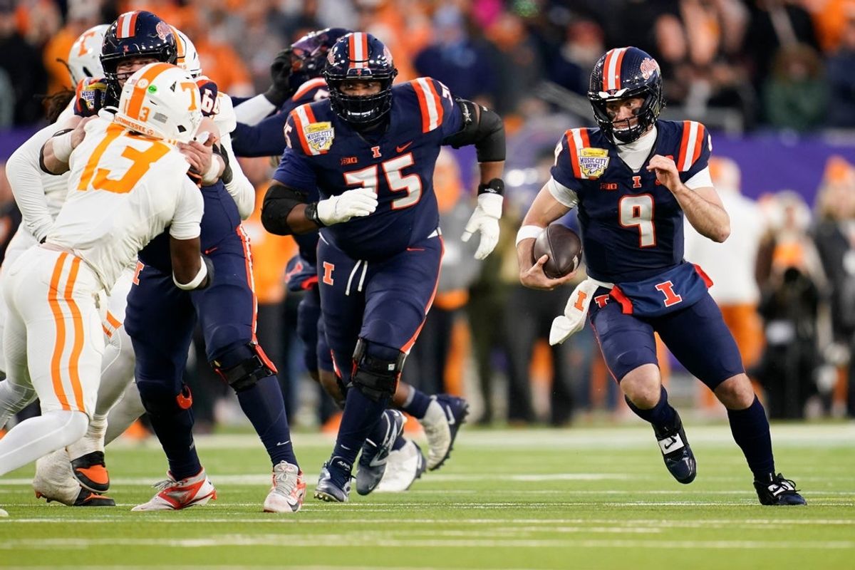 Illinois quarterback Luke Altmyer (9) runs the ball in the first quarter of the Music City Bowl against Tennessee in an NCAA football game on Dec. 30, 2025, in Nashville, Tennessee.