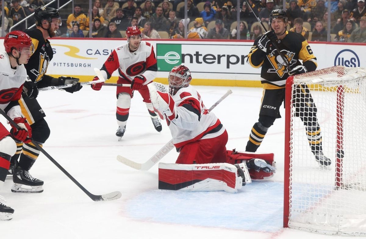 Dec 30, 2025; Pittsburgh, Pennsylvania, USA; Pittsburgh Penguins right wing Anthony Mantha (left) scores a goal against Carolina Hurricanes goaltender Frederik Andersen (31) during the first period at PPG Paints Arena. Mandatory Credit: Charles LeClaire-Imagn Images